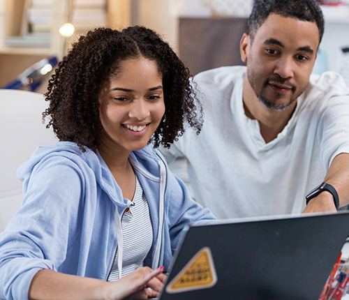 Father and daughter smiling