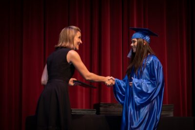 Graduate student receiving her diploma image