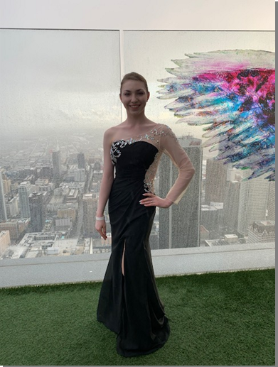 Graduation student wearing a black long dress for her prom image