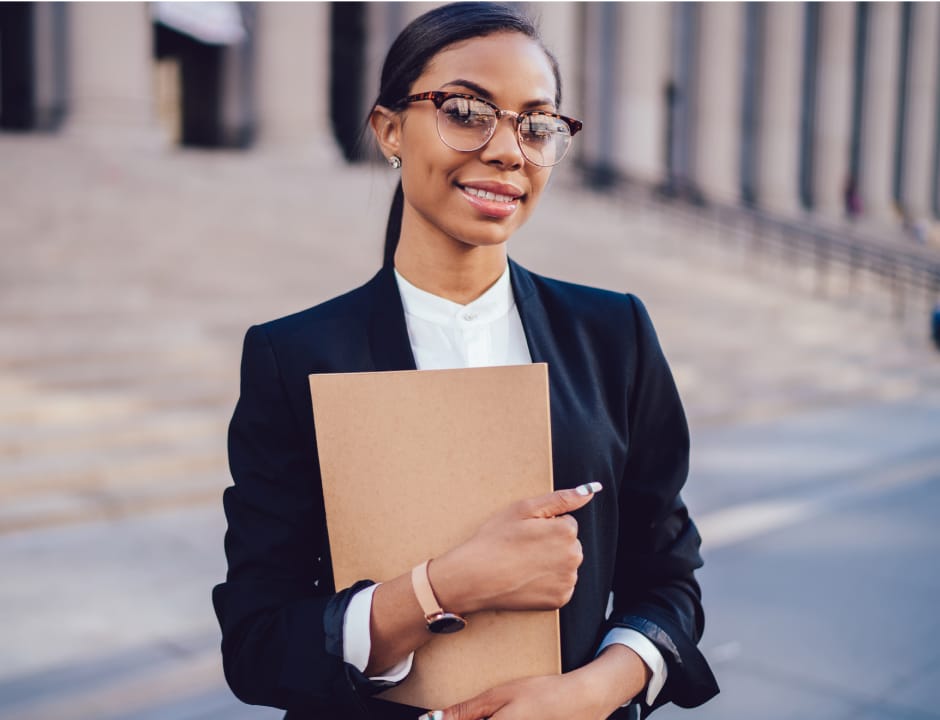 Law student wearing a black suite and glasses
