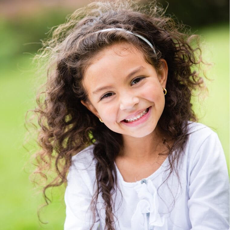 Elementary student smiling at the camera